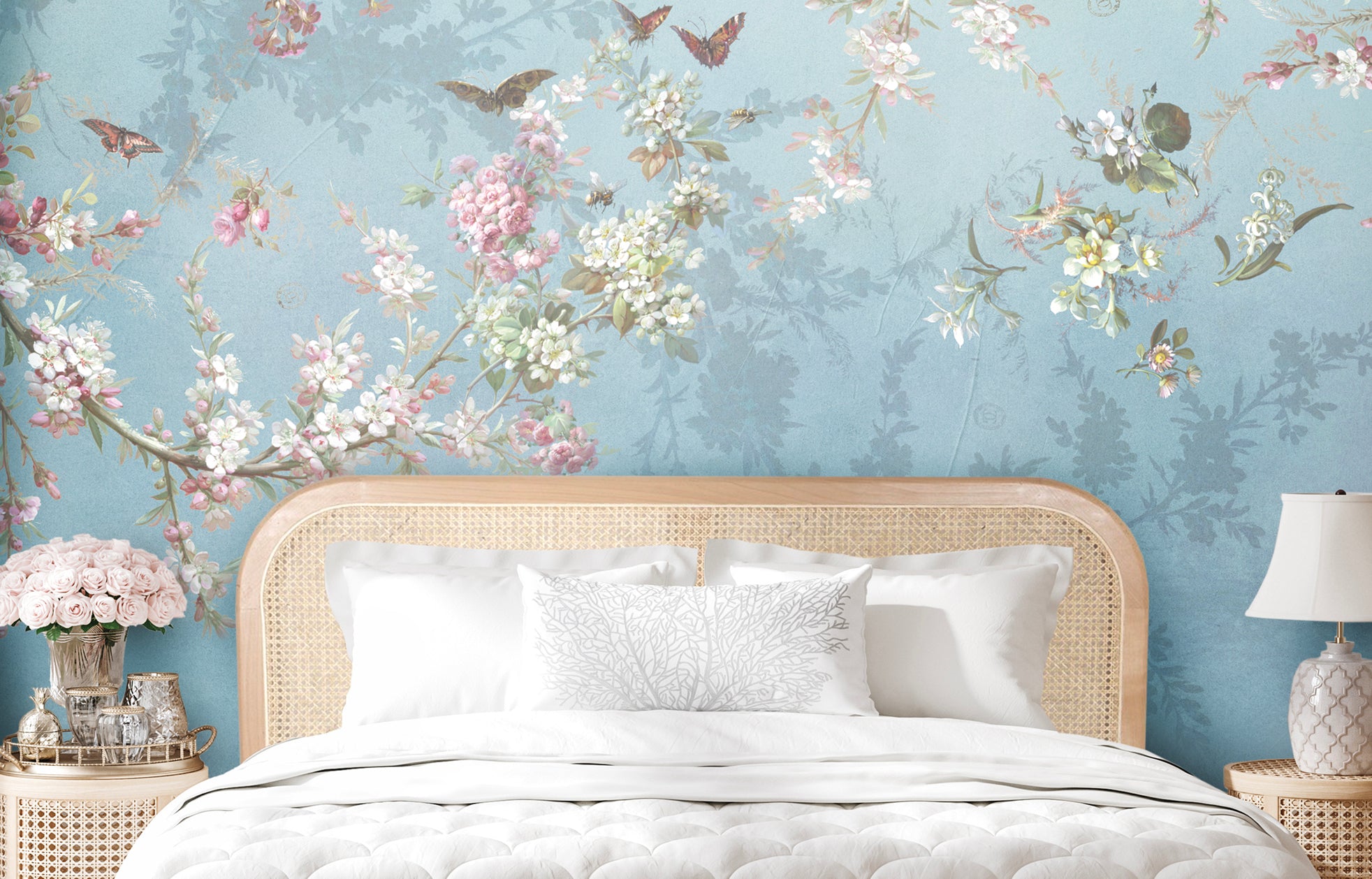 Dreamy mural wallpaper featuring delicate blossom branches with butterflies on a soft duck egg blue background.